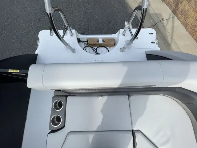 Slide: The Image of 2024 Hurricane FunDeck 1960 RE OB boat interior with seating and cup holders. - 12