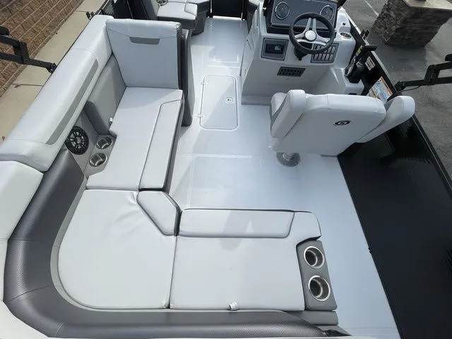 Slide: The Image of 2024 Hurricane FunDeck 1960 RE OB interior with spacious seating and modern helm. - 4