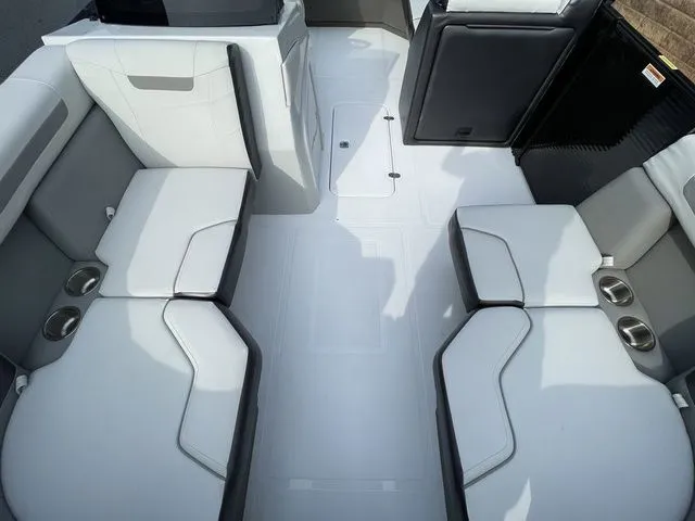 Slide: The Image of 2024 Hurricane FunDeck 1960 RE OB interior with spacious seating and cup holders. - 9