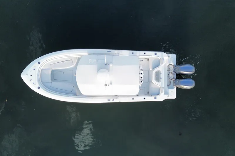 Slide: The Image of Overhead view of 2023 Contender 24 Sport boat on calm water. - 23