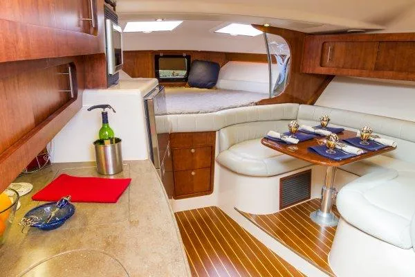 Slide: The Image of Manufacturer Provided Image: Luxurious interior of 2014 Grady-White Express 370 with kitchen and dining area. - 3