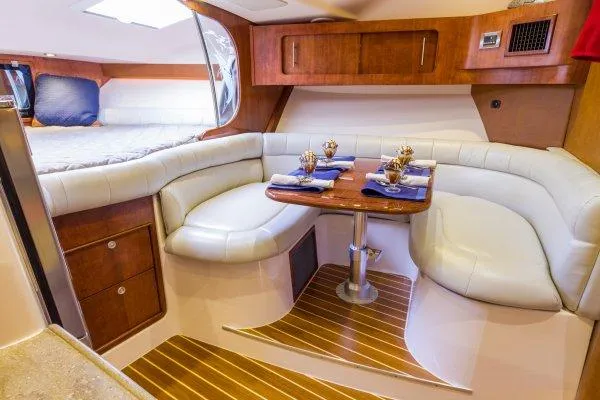 Slide: The Image of Manufacturer Provided Image: 2014 Grady-White Express 370 interior with dining area and cozy seating. - 4