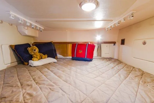 Slide: The Image of Manufacturer Provided Image: 2014 Grady-White Express 370 cabin with cozy bed, pillows, and teddy bear. - 5