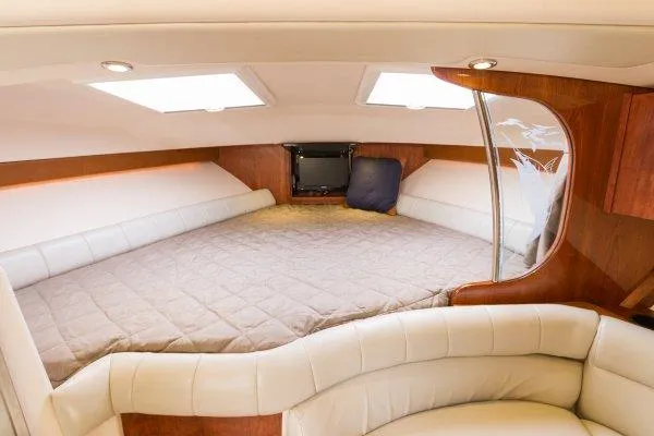 Slide: The Image of Manufacturer Provided Image: Luxurious cabin interior of 2014 Grady-White Express 370 boat with comfortable bedding. - 6