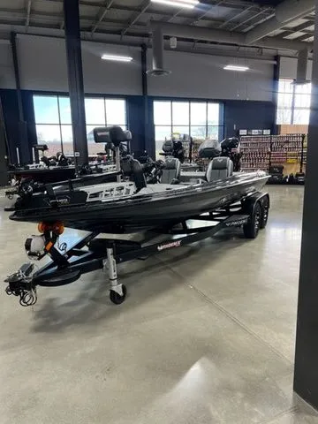 The Image of 2024 Phoenix Bass Boats 919 Elite in showroom, sleek design, advanced features. - 1