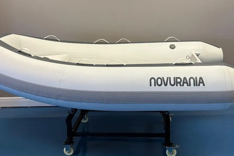 Slide: The Image of Novurania TR 270 boat cruising on a sunny lake, 2025 model. - 5