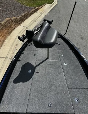 Slide: The Image of 2024 Phoenix Bass Boats 20 XE with elevated seat and fishing equipment on deck. - 10