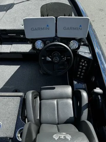 Slide: The Image of 2024 Phoenix Bass Boats 20 XE cockpit with dual Garmin displays and leather seating. - 7