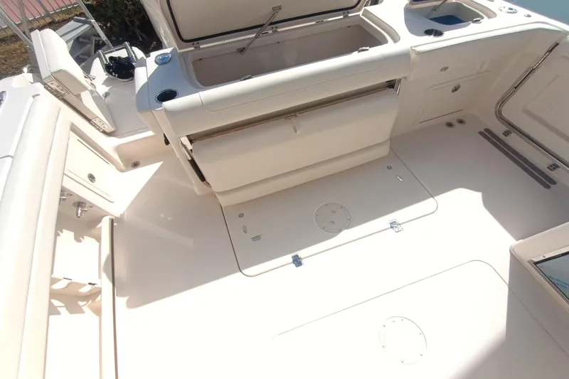 Slide: The Image of 2026 Grady-White Freedom 325 boat interior with seating and storage compartments. - 14