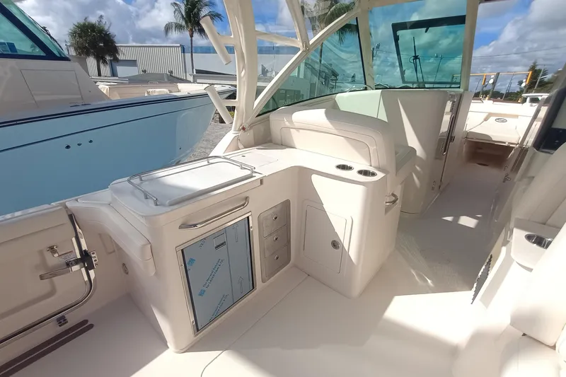 Slide: The Image of 2026 Grady-White Freedom 325 boat interior with seating and storage compartments. - 15