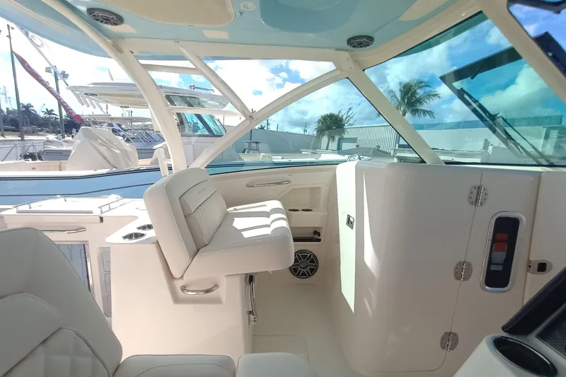 Slide: The Image of 2026 Grady-White Freedom 325 boat interior with luxurious seating and modern design. - 21