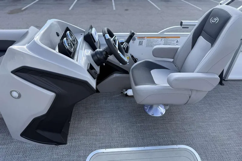 Slide: The Image of 2026 Barletta ARIA 22UC boat helm with modern steering and comfortable captain's chair. - 10