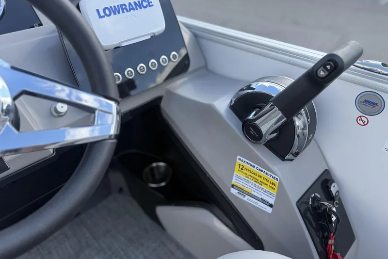 Slide: The Image of Control panel of 2026 Barletta ARIA 22UC boat with steering wheel and throttle. - 13