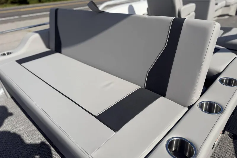 Slide: The Image of 2026 Barletta ARIA 22UC boat seating with cup holders, featuring sleek gray upholstery. - 27