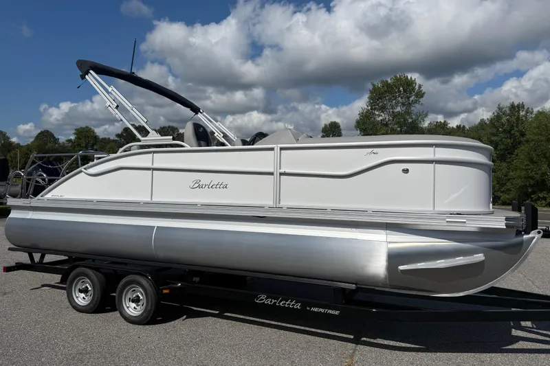 Slide: The Image of 2026 Barletta ARIA 22UC pontoon boat on trailer under cloudy sky. - 41
