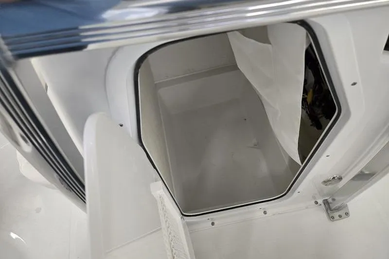 Slide: The Image of Storage compartment of 2026 Sea Hunt Ultra 219 boat, featuring sleek design and ample space. - 10