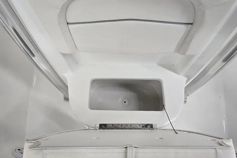 Slide: The Image of 2026 Sea Hunt Ultra 219 boat interior with storage compartment. - 14