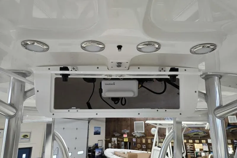 Slide: The Image of 2026 Sea Hunt Ultra 219 boat console with Garmin electronics and overhead lighting. - 15