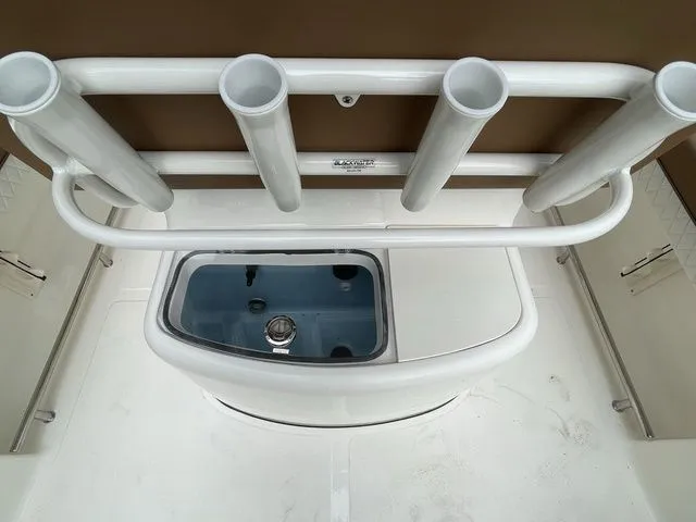 Slide: The Image of 2024 Pioneer Sportfish 202 boat with rod holders and livewell. - 6