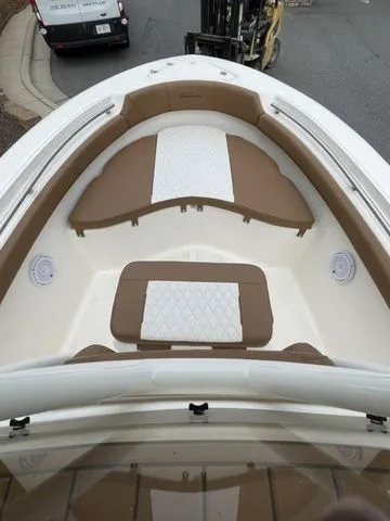 Slide: The Image of 2024 Pioneer Sportfish 202 boat interior with cushioned seating and modern design. - 7