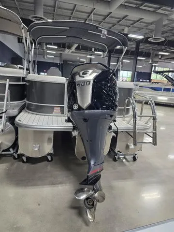 Slide: The Image of 2024 SunCatcher Select 322RC pontoon boat with powerful outboard motor in showroom. - 3