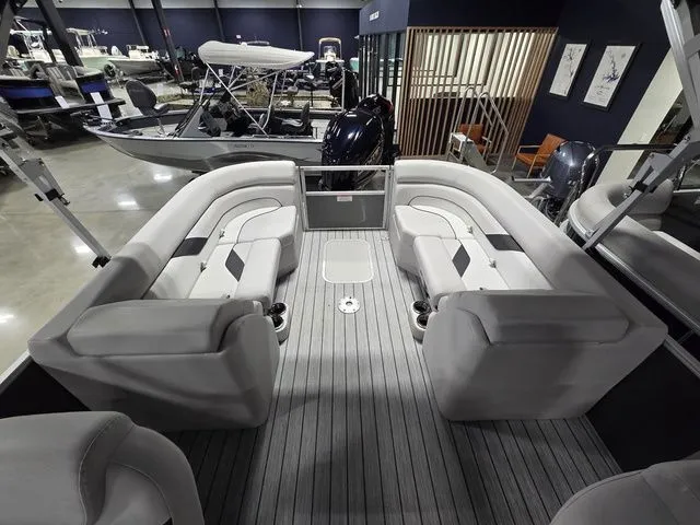 Slide: The Image of 2024 SunCatcher Select 322RC pontoon boat interior with plush seating and modern design. - 6