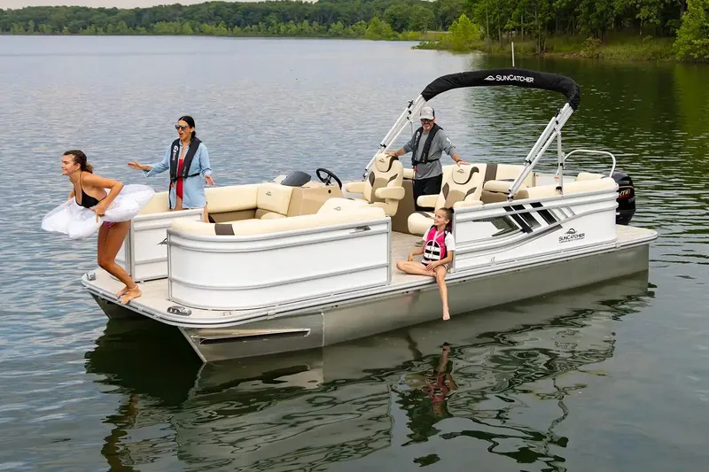 Slide: The Image of 2024 SunCatcher Select 322RC pontoon boat with people enjoying a day on the lake. - 8