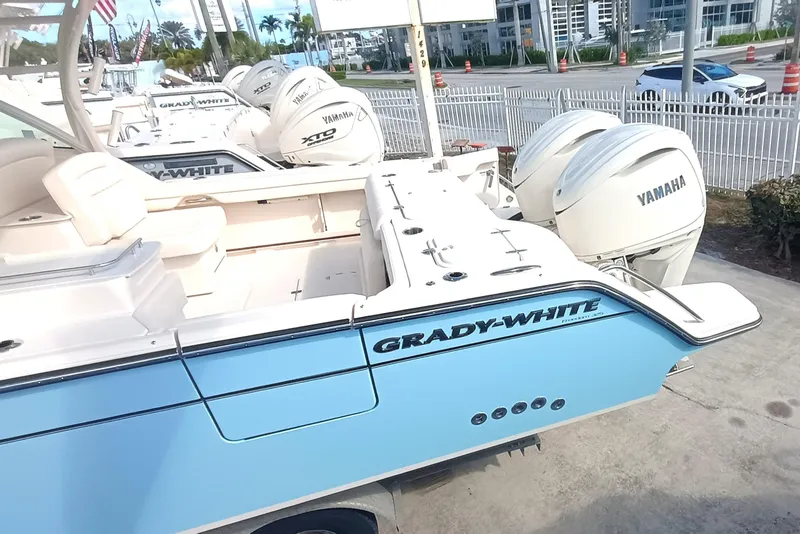 Slide: The Image of 2026 Grady-White Freedom 325 boat with Yamaha engines, displayed outdoors. - 10