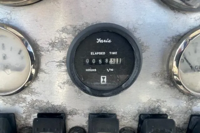 Slide: The Image of Hour meter on 2011 Triumph 190 Bay boat dashboard, showing 581.1 hours elapsed. - 6