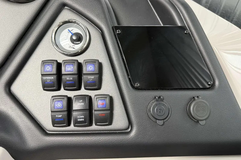 Slide: The Image of Control panel of 2026 Sylvan L3 CLZ DH boat with switches and gauges. - 12