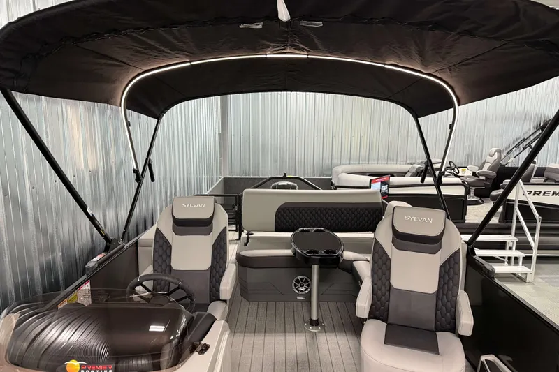 Slide: The Image of 2026 Sylvan L3 CLZ DH pontoon boat interior with canopy and seating. - 14