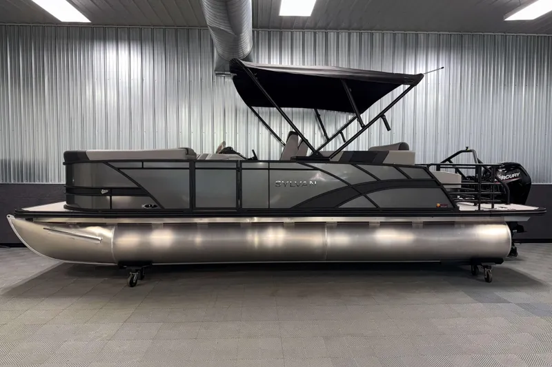 Slide: The Image of 2026 Sylvan L3 CLZ DH pontoon boat in showroom, sleek design, metallic finish. - 20