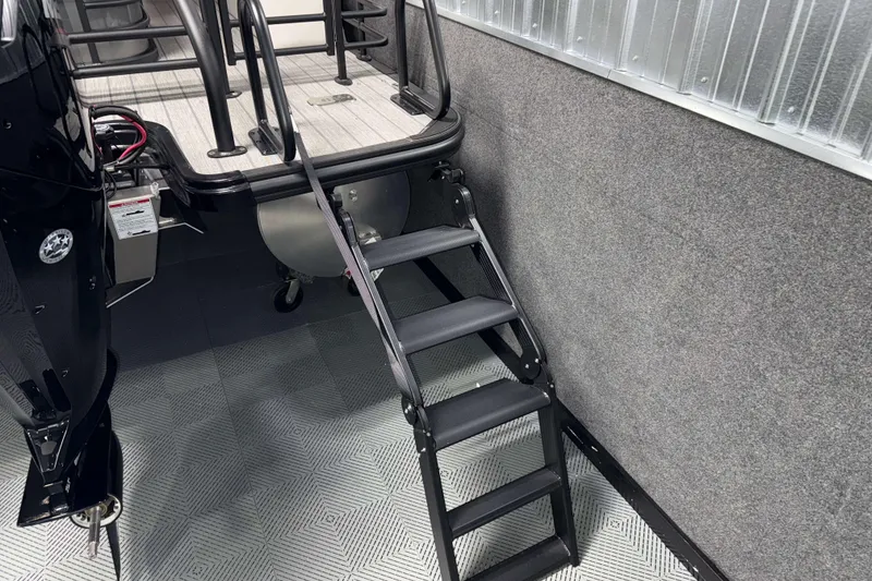 Slide: The Image of 2026 Sylvan L3 CLZ DH boat with ladder and motor, interior view. - 24