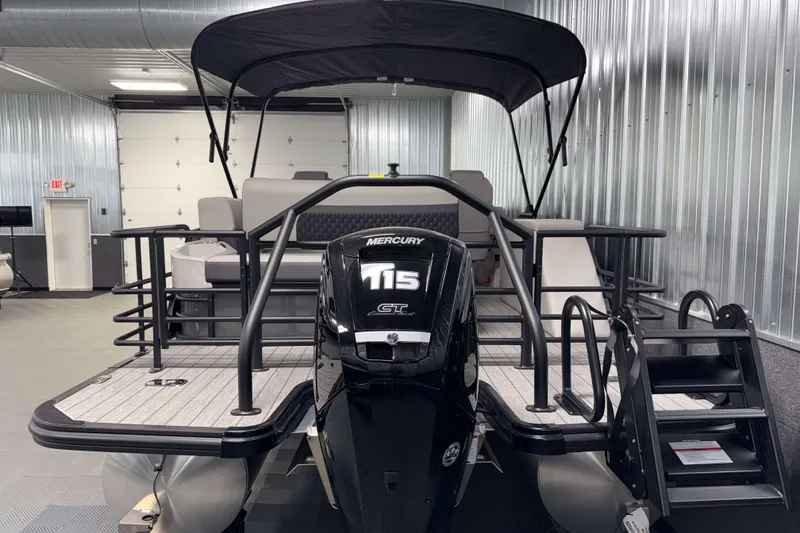 Slide: The Image of 2026 Sylvan L3 CLZ DH pontoon boat with Mercury 115 engine in showroom. - 25