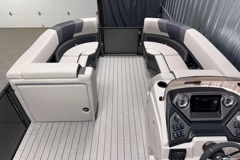 Slide: The Image of Luxurious interior of 2026 Sylvan L3 CLZ DH pontoon boat with modern seating and control panel. - 4