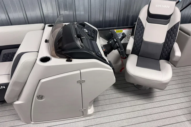 Slide: The Image of 2026 Sylvan L3 CLZ DH boat interior with steering console and captain's chair. - 6