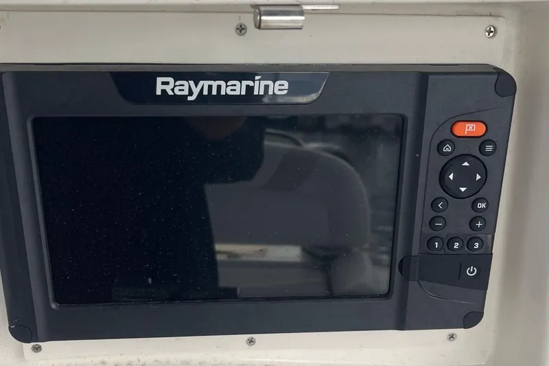 Slide: The Image of Raymarine navigation system on 2006 Boston Whaler 240 Outrage boat dashboard. - 15