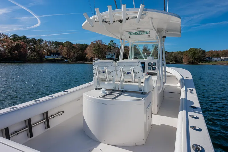Slide: The Image of 2008 Regulator 32 Forward Seating boat on a scenic lake with clear skies. - 10