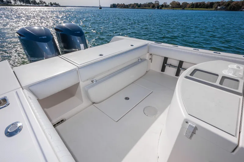 Slide: The Image of 2008 Regulator 32 Forward Seating boat with dual engines on a sunny lake. - 11