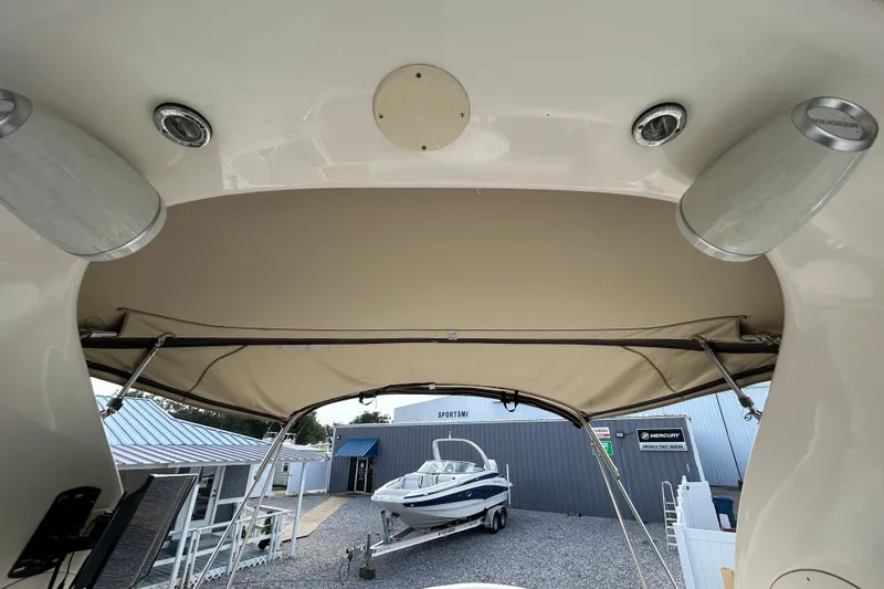 Slide: The Image of 2004 Sea Ray 280 Sundancer interior view with outdoor boat storage. - 20