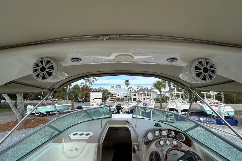 Slide: The Image of 2004 Sea Ray 280 Sundancer cockpit view with speakers and dashboard. - 21