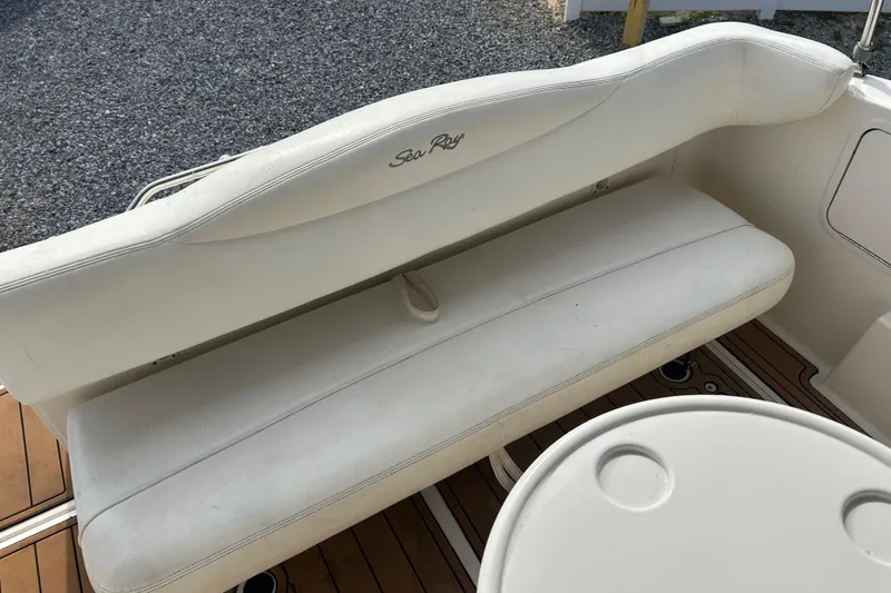 Slide: The Image of White seating area on a 2004 Sea Ray 280 Sundancer boat. - 9