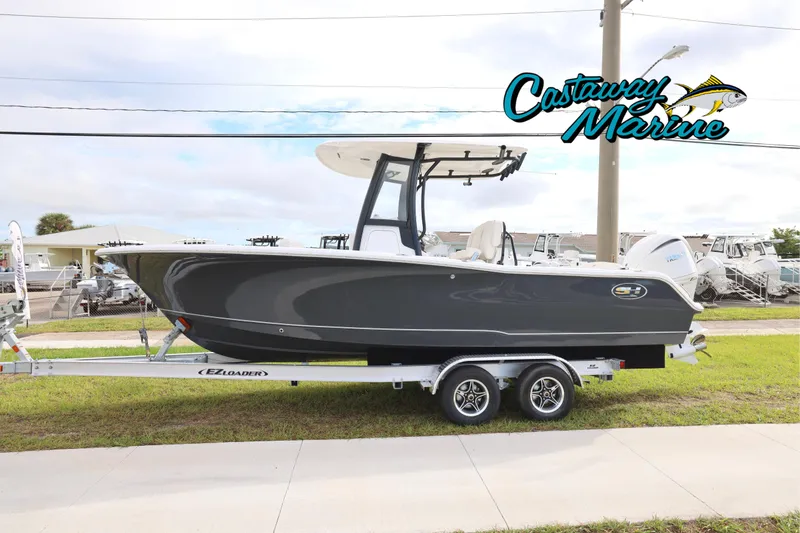The Image of 2026 Sea Hunt Ultra 245 SE boat on trailer at Castaway Marine dealership. - 0