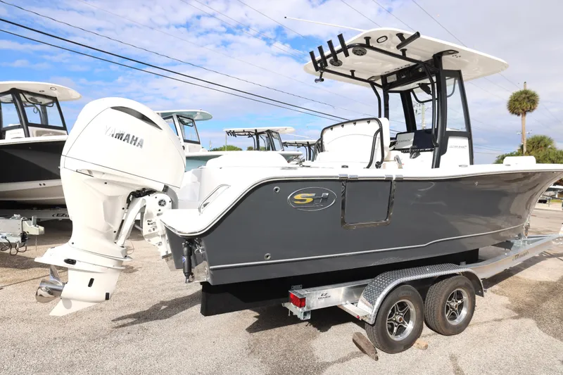 Slide: The Image of 2026 Sea Hunt Ultra 245 SE boat with Yamaha engine on trailer. - 5