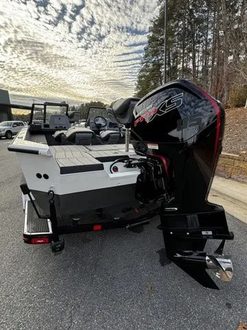 Slide: The Image of 2024 Vexus ADX180 boat with powerful outboard motor, parked on a scenic road. - 3