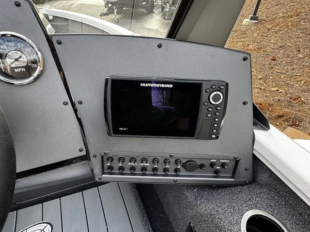Slide: The Image of 2024 Vexus ADX180 dashboard with Humminbird Helix 7 fishfinder and control panel. - 7