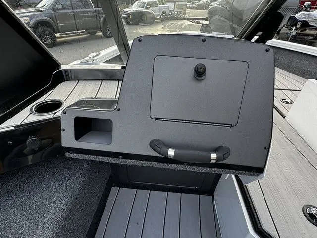 Slide: The Image of 2024 Vexus ADX180 boat interior with sleek dashboard and storage compartments. - 8
