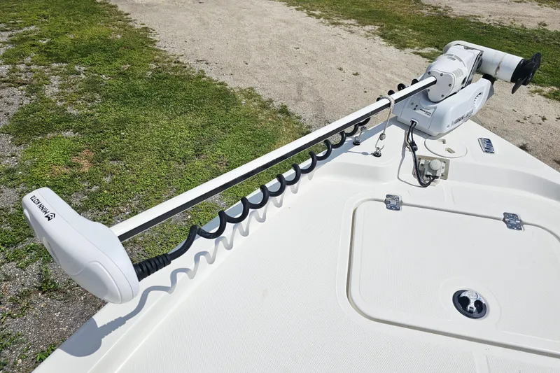 Slide: The Image of 2006 Triton 220 LTS boat with Minn Kota trolling motor on deck. - 31