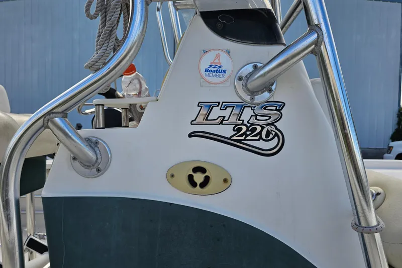 Slide: The Image of 2006 Triton 220 LTS boat console with Boatus Member sticker. - 7