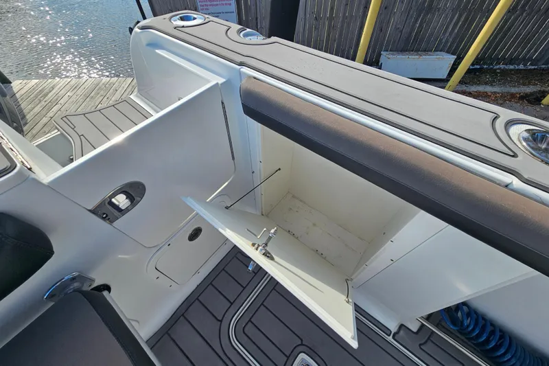 Slide: The Image of Open storage compartment on a 2006 Polar 2700 Center Console boat, dockside view. - 10